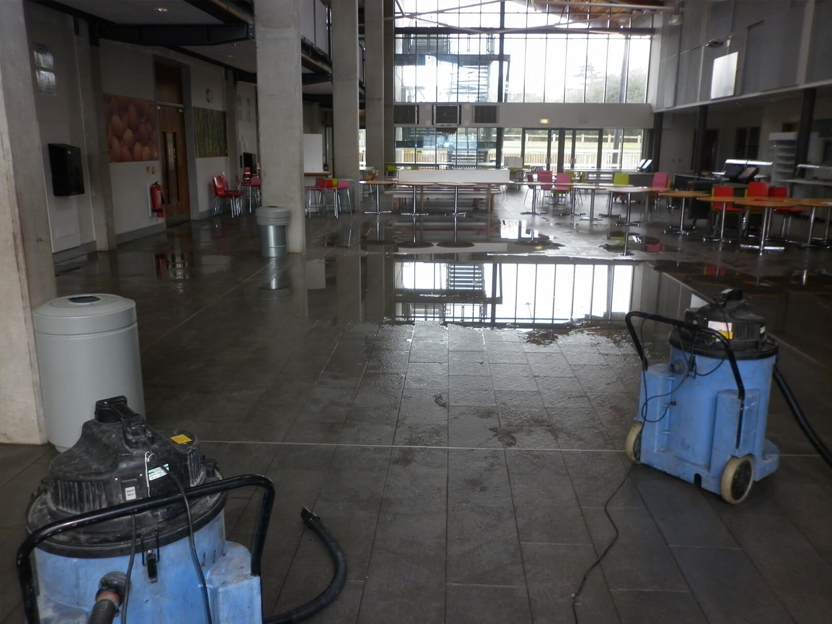 Flood damage cleanup equipment inside large commercial building