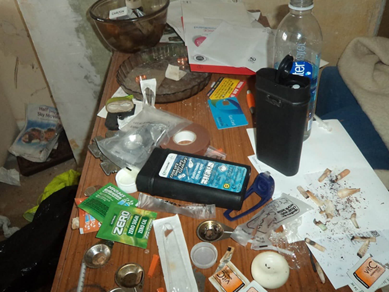 Needles and waste inside residential home