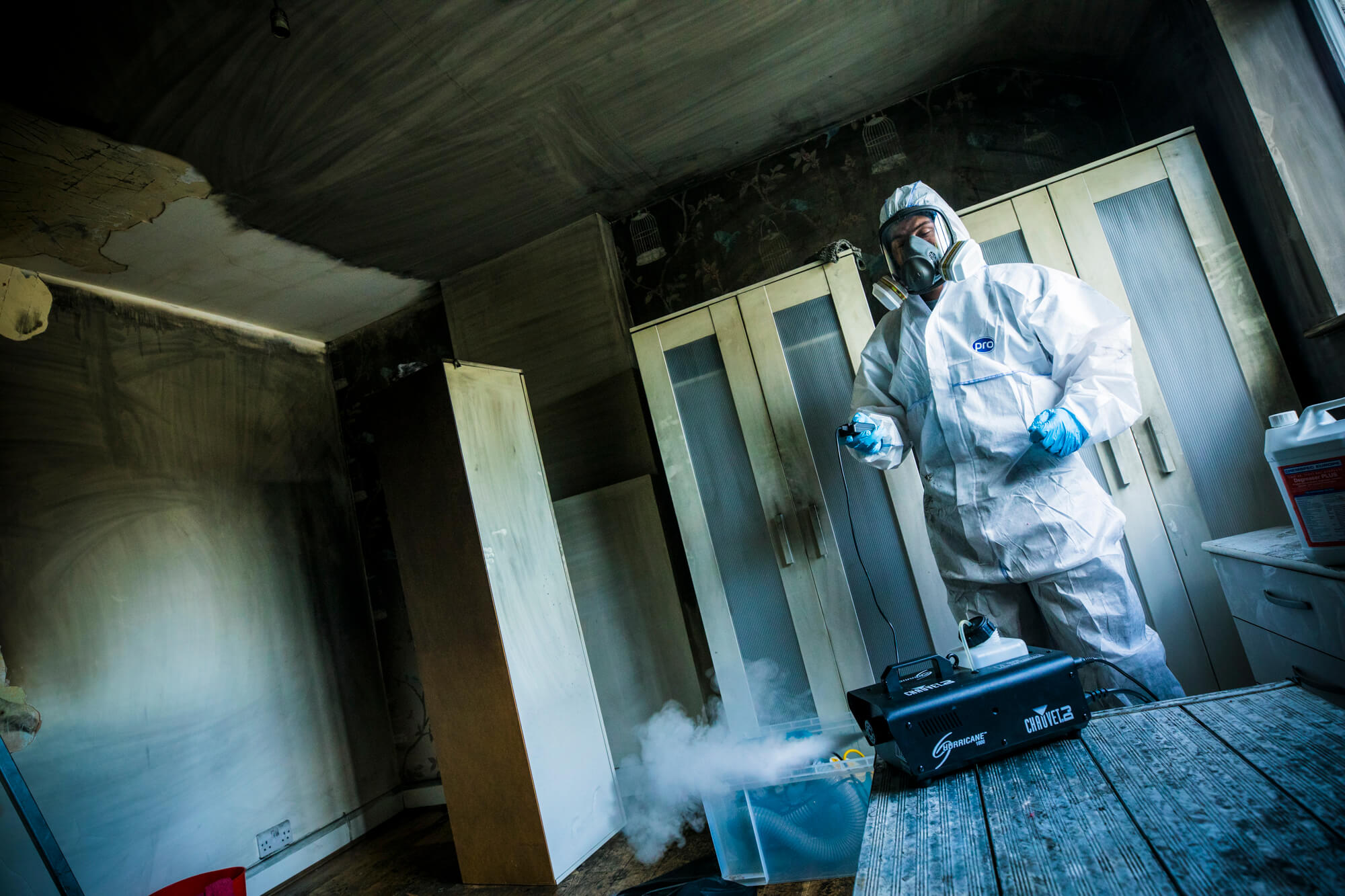 Technician using a fogging machine