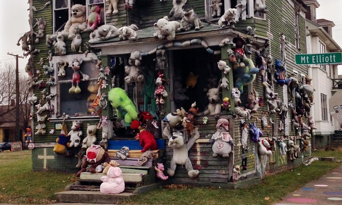 A house covered in stuffed animals and dolls