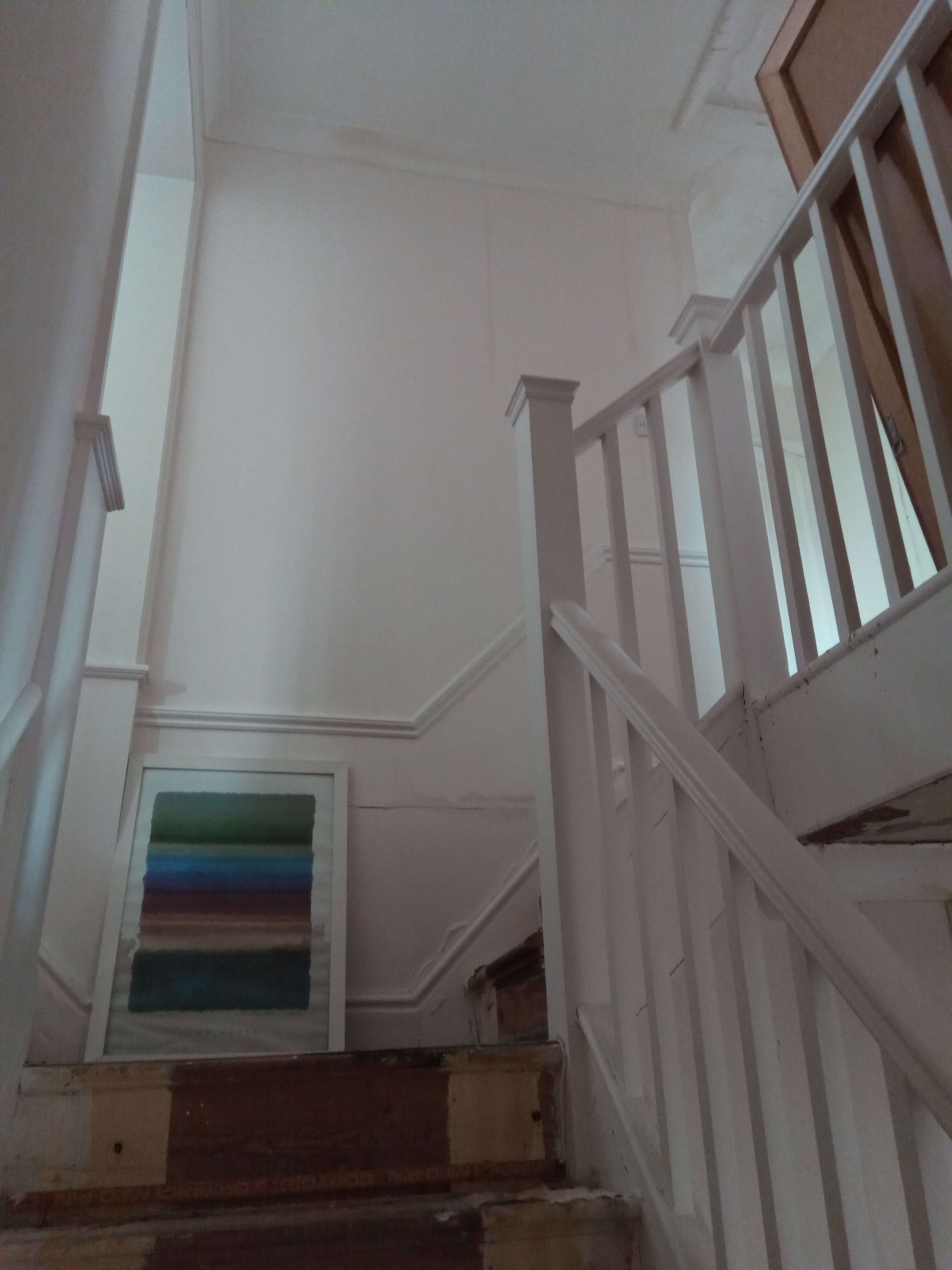 water damage at the top of the staircase