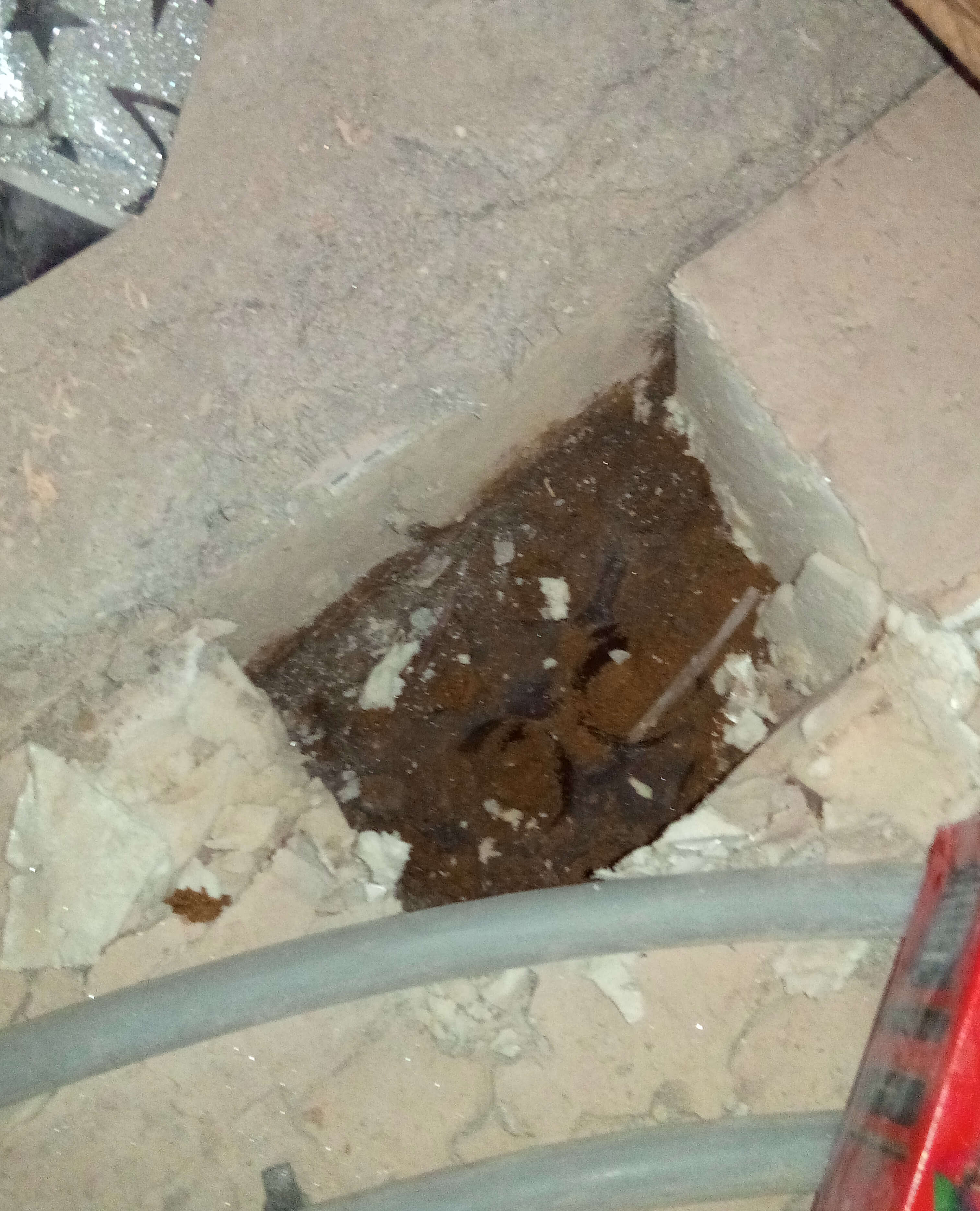 Inspection hole in flooded basement south west london