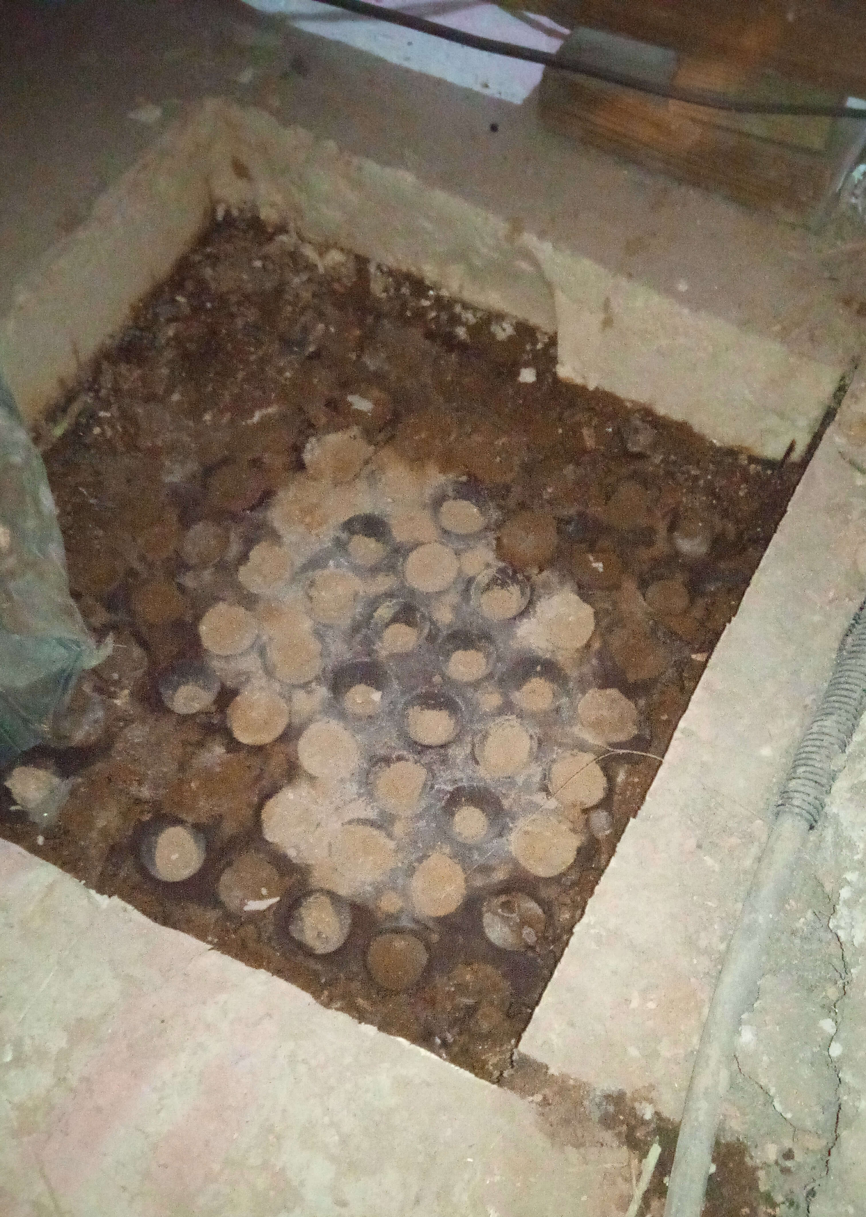 Inspection hole in flooded basement south west london