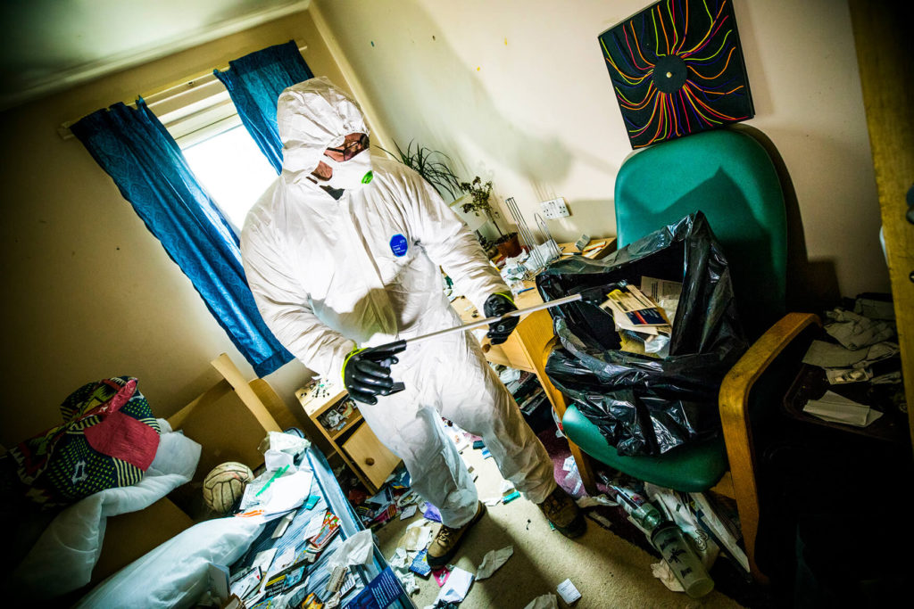 Ideal Response technician cleaning up after squatter eviction