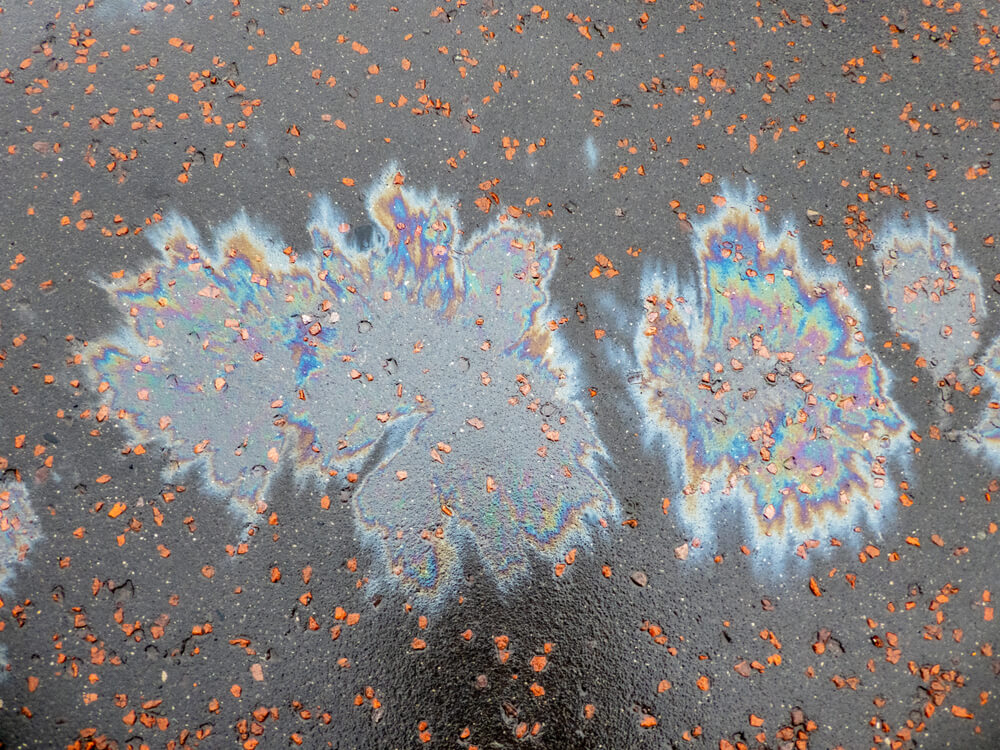 rainbow like reflection from oil spilt on tarmac