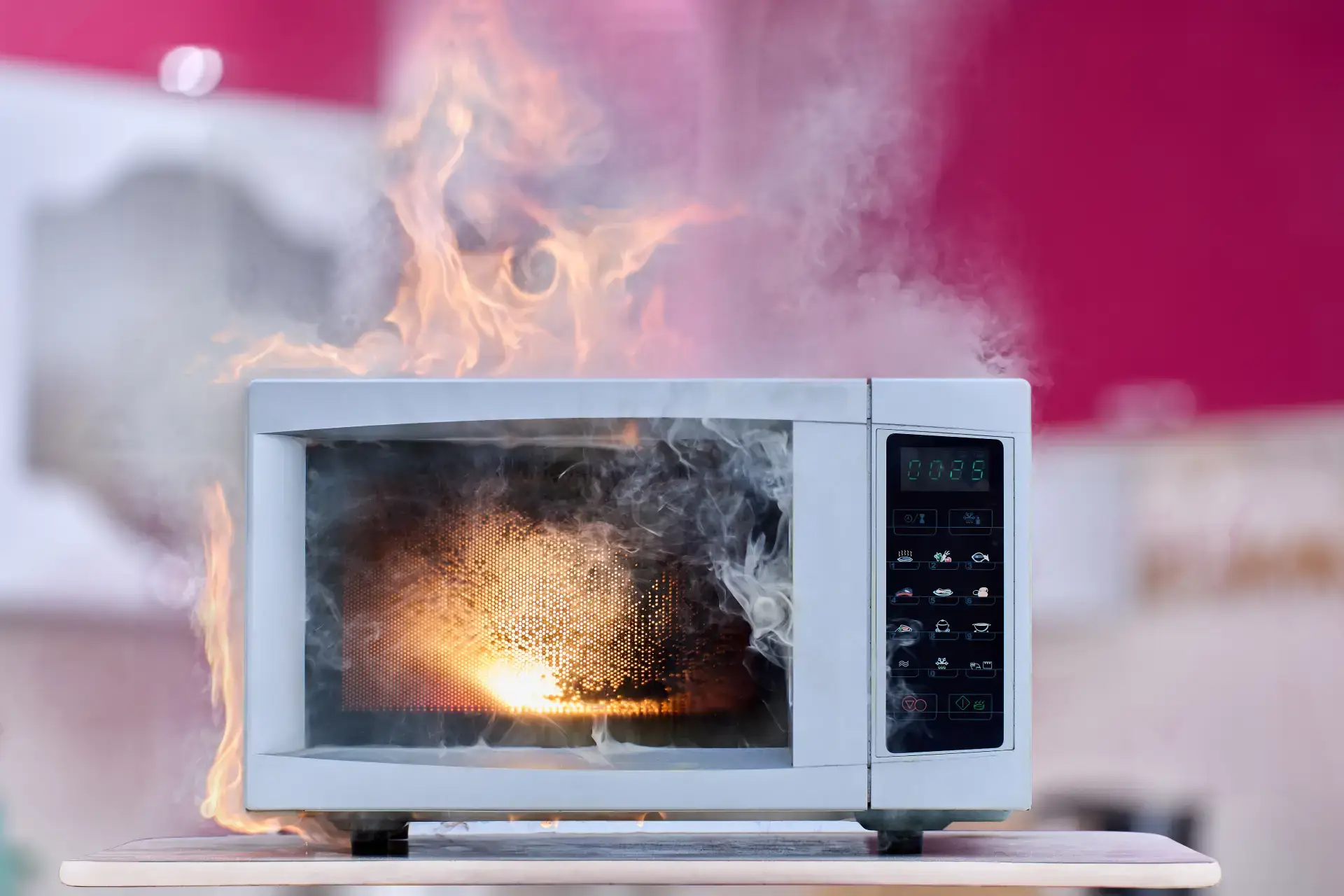 faulty microwave on fire