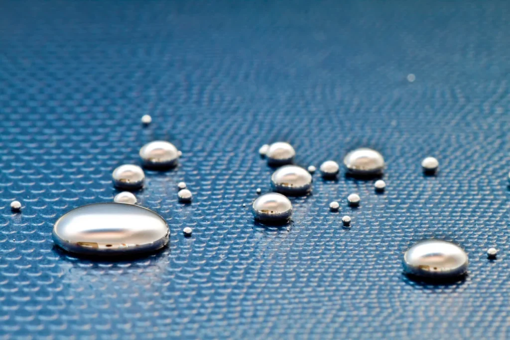Balls of spilled mercury on a hard surface.