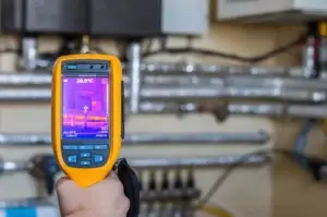 Thermal imaging leak detection tool being used to identify the location of commercial water leak.
