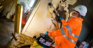 Technician cleaning a property following a fire.