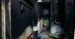 Soot damaged property with blackened walls.