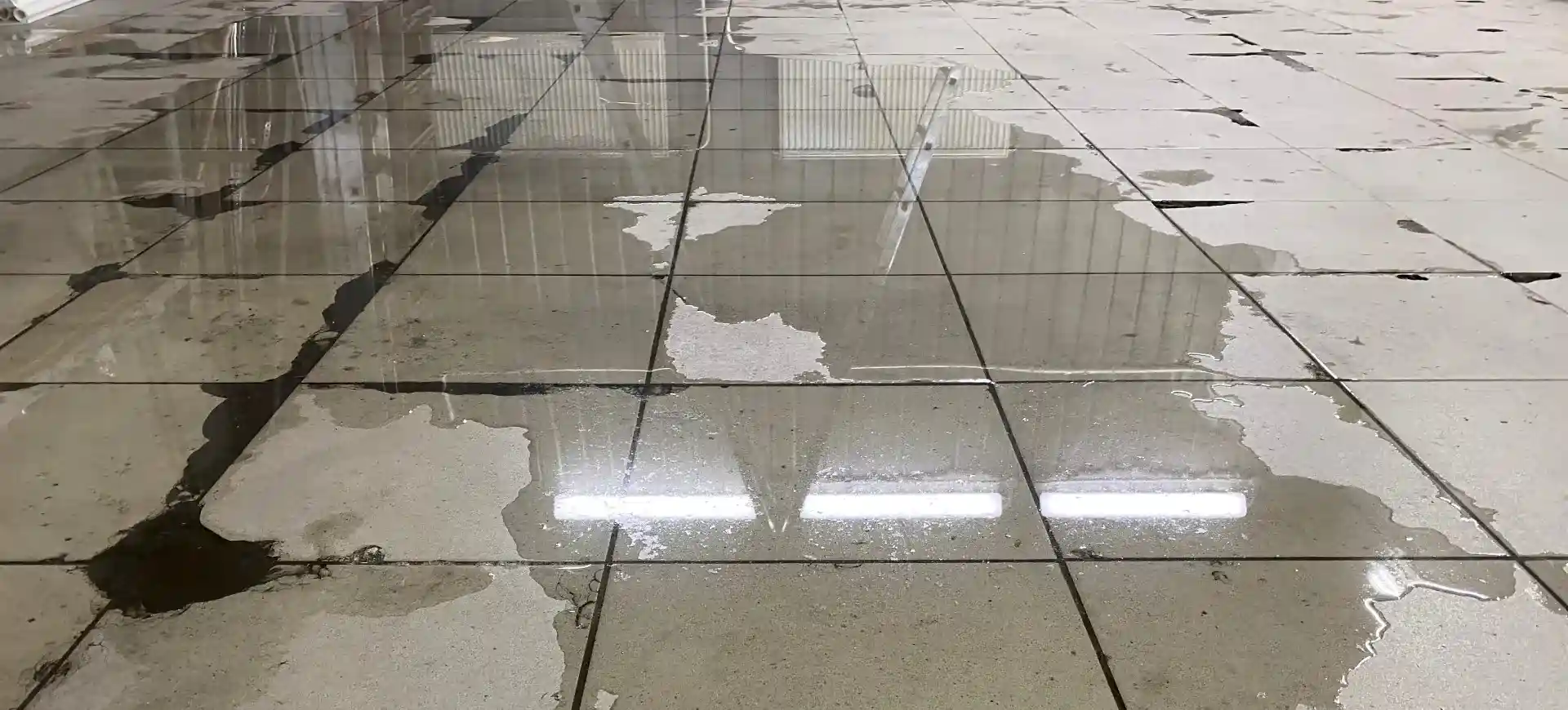 Commercial water damage. water on tiled floor of commercial unit