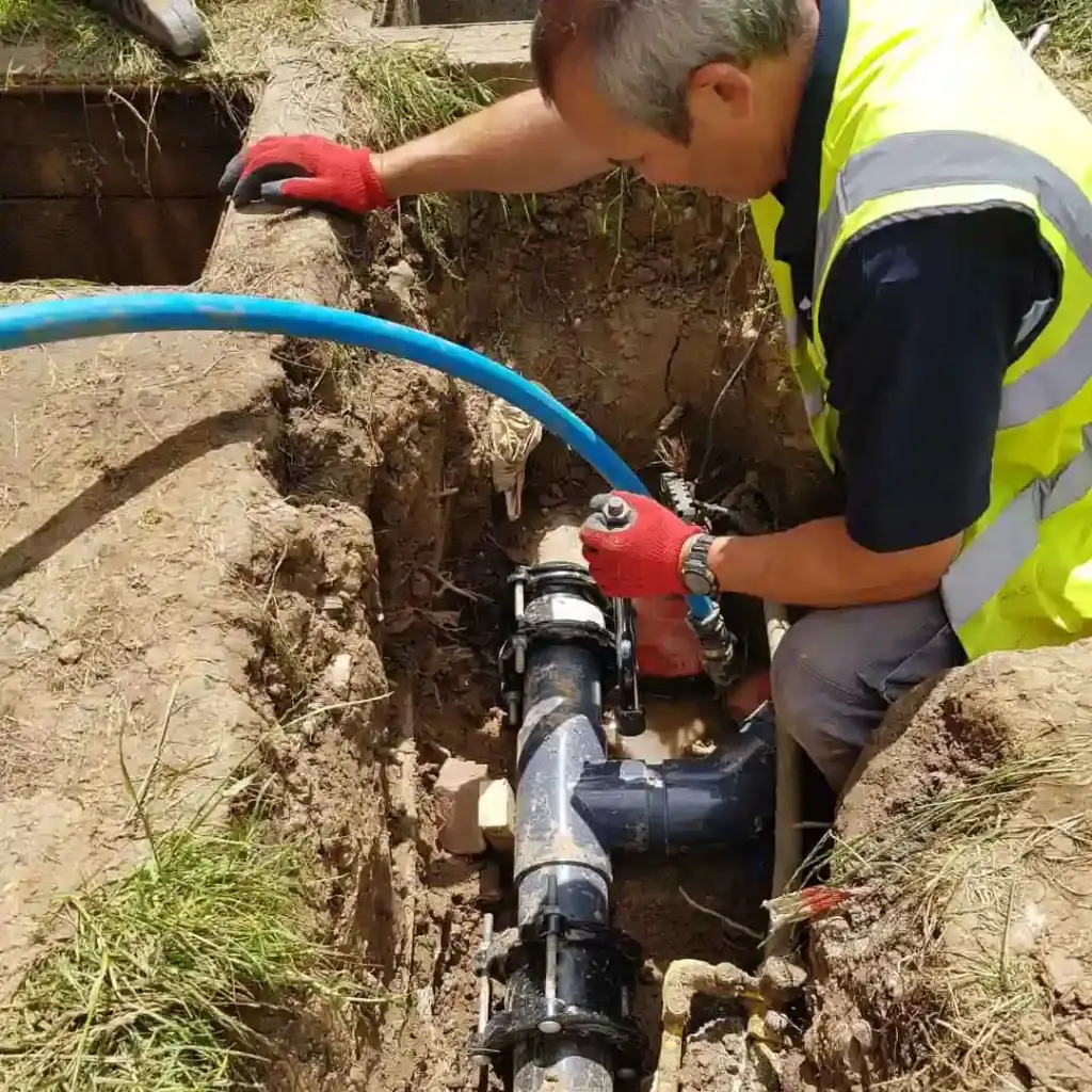 Leak detection specialist fixing leak