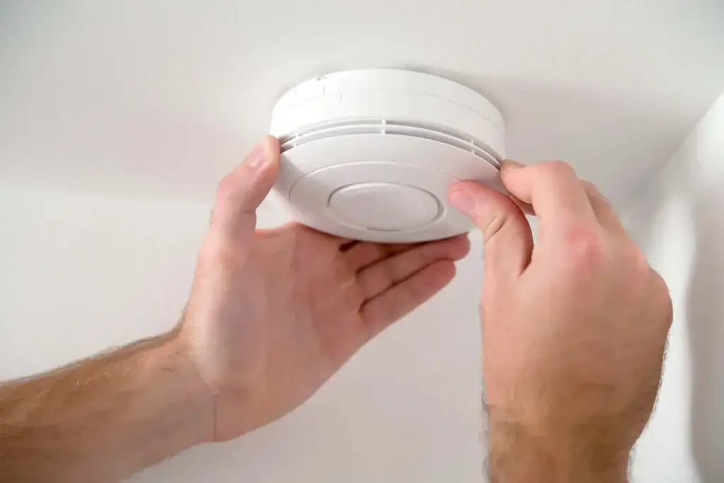 Fire alarm being installed in a UK property.
