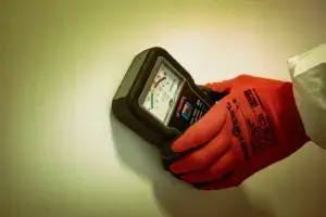 Close up of Ideal Response damp surveyor taking readings